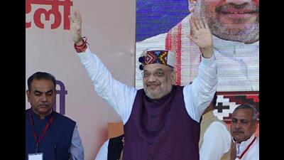 Union home minister Amit Shah greets people during the Hattee Aabhar Rally at Sataun in Sirmaur district on Saturday. (HT Photo) Union home minister Amit Shah greets people during the Hattee Aabhar Rally at Sataun in Sirmaur district on Saturday. (HT Photo)