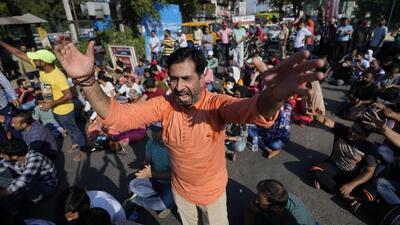 Kashmiri Hindus shout slogans against the killing of Puran Krishan Bhat, shot dead at his home in Shopian, during a protest in Jammu on Saturday. (AP)
