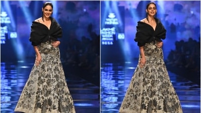 Genelia's blouse comes in a black hue and features an off-shoulder neckline, layered silhouette and a cropped hem. She wore it with a grey-coloured A-line skirt adorned in a black motif print and a floor-grazing length. (HT Photo/Varinder Chawla) Genelia's blouse comes in a black hue and features an off-shoulder neckline, layered silhouette and a cropped hem. She wore it with a grey-coloured A-line skirt adorned in a black motif print and a floor-grazing length. (HT Photo/Varinder Chawla)