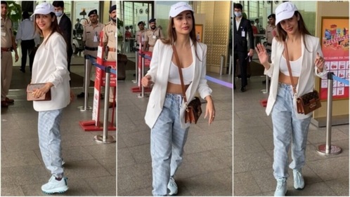 Malaika Arora wears a sports bra, denim joggers and a blazer for her airport look. (HT Photo/Varinder Chawla) Malaika Arora wears a sports bra, denim joggers and a blazer for her airport look. (HT Photo/Varinder Chawla)