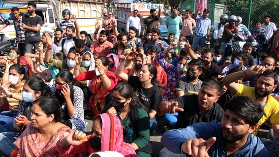 Kashmiri Pandits protesting against the 'targeted killing' of Puran Krishan Bhat on Saturday in Jammu and Kashmir's Shopian district.(ANI)