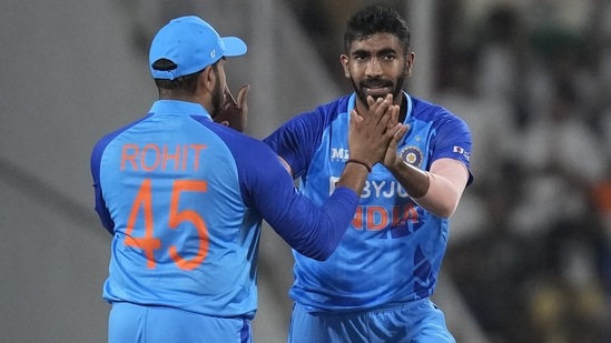 India's Jasprit Bumrah, right, celebrates with captain Rohit Sharma (AP)