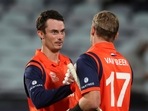 Netherlands' not-out batsmen Logan van Beek, right, and Scott Edwards shake hands after their win over UAE Netherlands' not-out batsmen Logan van Beek, right, and Scott Edwards shake hands after their win over UAE