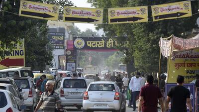 There are 15 wholesalers of firecrackers in Gadolia who witnessed long queues of buyers and allowed five people at a time to choose from display racks set up inside their godowns. (Parveen Kumar/HT Photo)