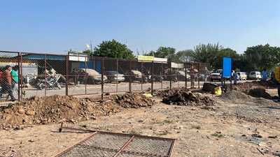 MC has fenced the land and installed a board announcing that it belongs to the Chandigarh municipal corporation. (HT Photo)