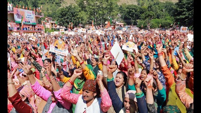 Bharatiya Janata Party (BJP) supporters attend the 'Hattee Aabhar Rally' addressed by Union Home Minister Amit Shah in Sataun village, Shillai, in Sirmaur. (ANI)