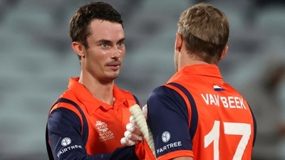 Netherlands' not-out batsmen Logan van Beek, right, and Scott Edwards shake hands after their win over UAE (AP) Netherlands' not-out batsmen Logan van Beek, right, and Scott Edwards shake hands after their win over UAE (AP)