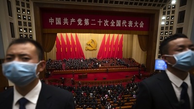 Security officers wearing face masks stand guard after the opening ceremony of the National Congress of China's ruling Communist Party. (AP) Security officers wearing face masks stand guard after the opening ceremony of the National Congress of China's ruling Communist Party. (AP)