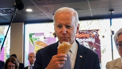 U.S. President Joe Biden eats ice cream during a stop at an ice cream shop in Portland, Oregon, U.S. (REUTERS)