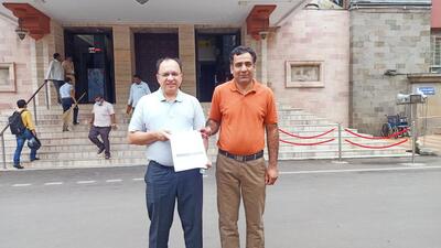 NCRF representative Sunil Koloti (left) with petition copy submitted to Pune municipal commissioner Vikram Kumar. (HT PHOTO)