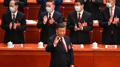 China's President Xi Jinping (centre) arrives for the opening session of the 20th Chinese Communist Party’s Congress at the Great Hall of the People in Beijing on Sunday. (AFP) China's President Xi Jinping (centre) arrives for the opening session of the 20th Chinese Communist Party’s Congress at the Great Hall of the People in Beijing on Sunday. (AFP)