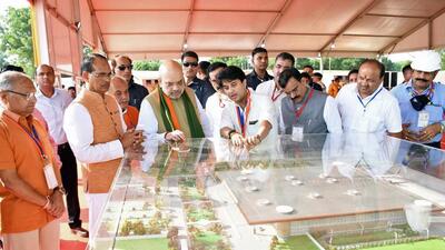 Union home minister Amit Shah looks at the model of the new terminal building of Rajmata Vijayaraje Scindia Terminal at its foundation stone laying ceremony, in Gwalior on Sunday. Union ministers Jyotiraditya Scindia, Narendra Singh Tomar, Madhya Pradesh chief minister Shivraj Singh Chouhan and other dignitaries are also present. (ANI) Union home minister Amit Shah looks at the model of the new terminal building of Rajmata Vijayaraje Scindia Terminal at its foundation stone laying ceremony, in Gwalior on Sunday. Union ministers Jyotiraditya Scindia, Narendra Singh Tomar, Madhya Pradesh chief minister Shivraj Singh Chouhan and other dignitaries are also present. (ANI)