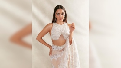 One of India's most celebrated designers Manish Malhotra shared Kiara Advani's photos in his couture on his Instagram handle and wrote, "Saree the most elegant nine yards of drape always .Beautiful @kiaraaliaadvani ethereal in #white #chikankari and pearl saree .." (Instagram/@manishmalhotra)