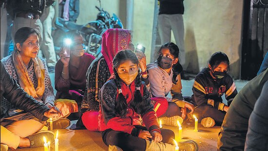 Local residents during a candlelight protest against Puran Krishan Bhat’s killing, in Srinagar on Sunday. (AP)