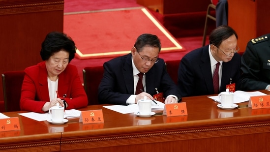 Chinese Vice Premier Sun Chunlan, Shanghai Communist Party Secretary Li Qiang and Yang Jiechi, director of the office of the Central Commission for Foreign Affairs, attend the opening ceremony of the 20th National Congress of the Communist Party of China.(REUTERS)