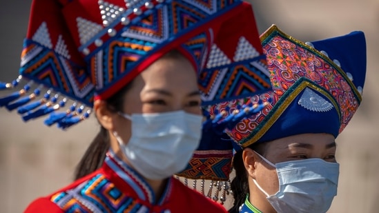 Delegates in ethnic minority dress seen amid the opening ceremony of the National Congress of Communist Party at the Great Hall of the People in Beijing.(AP)