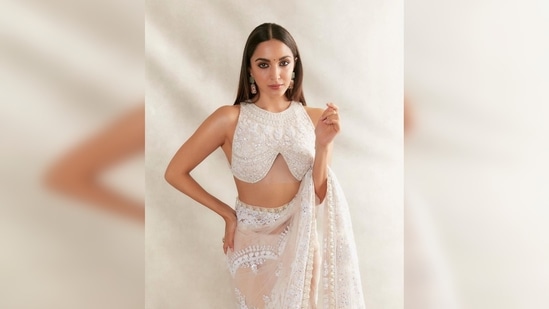 One of India's most celebrated designers Manish Malhotra shared Kiara Advani's photos in his couture on his Instagram handle and wrote, "Saree the most elegant nine yards of drape always .Beautiful @kiaraaliaadvani ethereal in #white #chikankari and pearl saree .."(Instagram/@manishmalhotra)