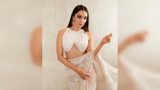 Kiara Advani looked like a dream in this chikankari sheer saree featuring pearl detailing and intricate embroidery.(Instagram/@manishmalhotra)