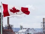 Indian Students In Canada: A Canada flag flies in Hamilton, Ontario. Indian Students In Canada: A Canada flag flies in Hamilton, Ontario.