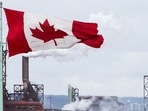 Canada Express Entry System: A Canada flag flies in Hamilton, Ontario. Canada Express Entry System: A Canada flag flies in Hamilton, Ontario.