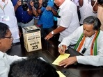 Congress presidential candidate Shashi Tharoor goes through the election procedure to cast his vote, at Indira Bhavan, in Thiruvananthapuram.