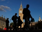 Pedestrians walk past the Elizabeth Tower, more commonly known as Big Ben for the bell inside the tower's clock, at the the Houses of Parliament in central London. Pedestrians walk past the Elizabeth Tower, more commonly known as Big Ben for the bell inside the tower's clock, at the the Houses of Parliament in central London.