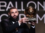 Real Madrid's French forward Karim Benzema receives the Ballon d'Or award during the 2022 Ballon d'Or France Football award ceremony Real Madrid's French forward Karim Benzema receives the Ballon d'Or award during the 2022 Ballon d'Or France Football award ceremony