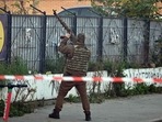 Russia-Ukraine War: A Ukrainian serviceman attempts to shoot down a drone during an attack in Kyiv.