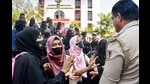 The hijabi girls have not refused to wear the uniform. They want to wear the hijab over and above the uniform. An educational institution can frame its uniform policy. But equally, it cannot demand rigid insistence on uniformity, devoid of social circumstance (PTI) The hijabi girls have not refused to wear the uniform. They want to wear the hijab over and above the uniform. An educational institution can frame its uniform policy. But equally, it cannot demand rigid insistence on uniformity, devoid of social circumstance (PTI)