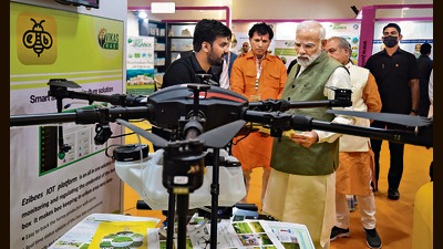 Prime Minister Narendra Modi inspects the products on display at the inauguration of PM Kisan Samman Sammelan 2022, in New Delhi on Monday. (PTI) Prime Minister Narendra Modi inspects the products on display at the inauguration of PM Kisan Samman Sammelan 2022, in New Delhi on Monday. (PTI)