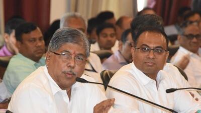 District guardian minister and president of the district planning committee Chandrakant Patil (C) during a meeting in Pune. (HT PHOTO)