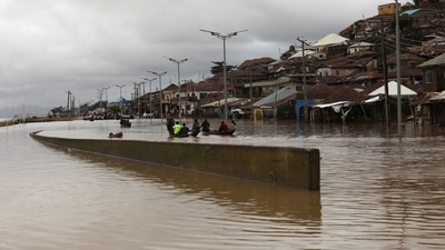 Nigeria Floods: Flood water breaks a river bank and overflows into a settlement in Lokoja, Nigeria. (Reuters)
