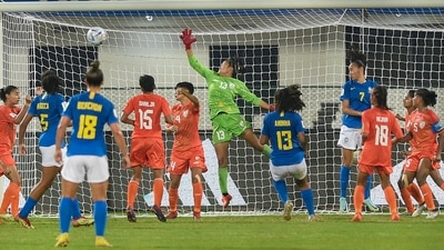 Indian goalkeeper Melody Keisham (13) saves an attack of Brazilian team during the FIFA U-17 Women's World Cup match between India and Brazil (PTI) Indian goalkeeper Melody Keisham (13) saves an attack of Brazilian team during the FIFA U-17 Women's World Cup match between India and Brazil (PTI)
