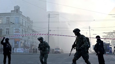 Russia-Ukraine War: Ukrainian servicemen and police officers stand guard in a street after a drone attack in Kyiv. (AFP) Russia-Ukraine War: Ukrainian servicemen and police officers stand guard in a street after a drone attack in Kyiv. (AFP)