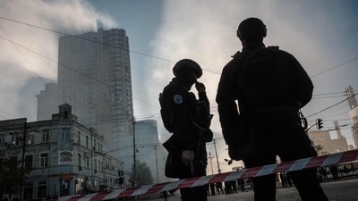 Russia-Ukraine War: Ukrainian police officers stand guard in a street after a drone attack in Kyiv. (AFP)