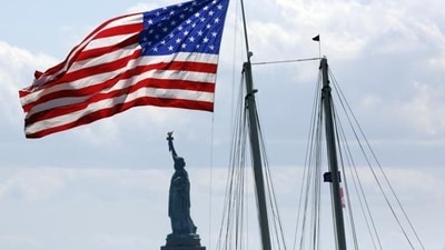 US Visa: A United States flag near the Statue of Liberty in New York. (AP)