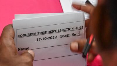 A Congress worker prepares a voter’s slip at the Karnataka State Congress office during the elections held to choose All India Congress Committee party president, in Bengaluru. (AFP) A Congress worker prepares a voter’s slip at the Karnataka State Congress office during the elections held to choose All India Congress Committee party president, in Bengaluru. (AFP)