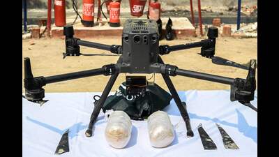 Packets of heroin and a drone are displayed during a media briefing after it was confiscated by Border Security Force (BSF) from near the border outpost of Ranian about 30 km from Amritsar on Monday. (AFP) Packets of heroin and a drone are displayed during a media briefing after it was confiscated by Border Security Force (BSF) from near the border outpost of Ranian about 30 km from Amritsar on Monday. (AFP)