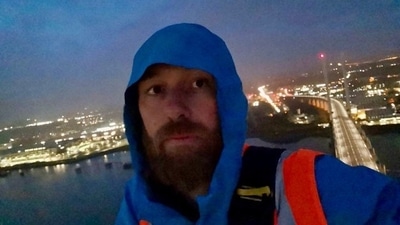 One of the protesters, Morgan Trowland, posted on Twitter a clip of himself at the top of the bridge. (@JustStop_Oil/ Twitter) One of the protesters, Morgan Trowland, posted on Twitter a clip of himself at the top of the bridge. (@JustStop_Oil/ Twitter)