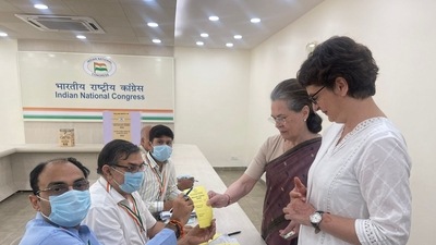 Sonia Gandhi and her daughter, party general secretary Priyanka Gandhi Vadra, cast their vote at the Congress' HQ in Delhi. (Congress/ Twitter)