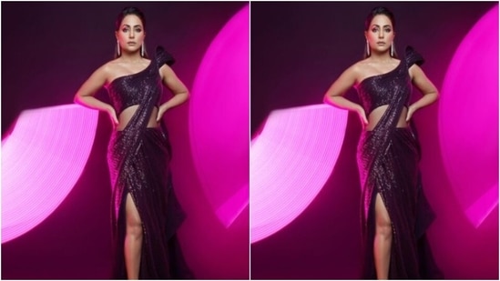 Hina looked drool-worthy in the shimmery maroon sequined saree gown as she posed for the cameras.(Instagram/@realhinakhan)