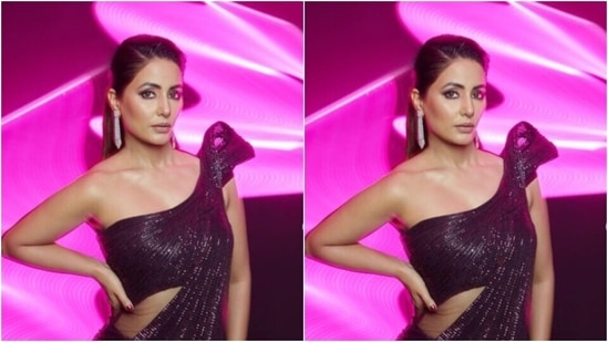 Hina’s attire featured maroon shimmery blouse with sequin details and off shoulder details. The blouse also came with a dramatic shoulder short cape in one shoulder.(Instagram/@realhinakhan)