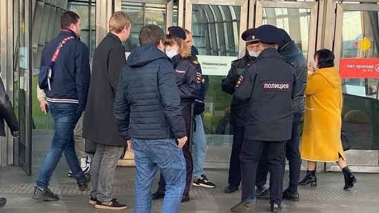 Russia-Ukraine War: Men stopped outside metro station entrances. Russia-Ukraine War: Men stopped outside metro station entrances.