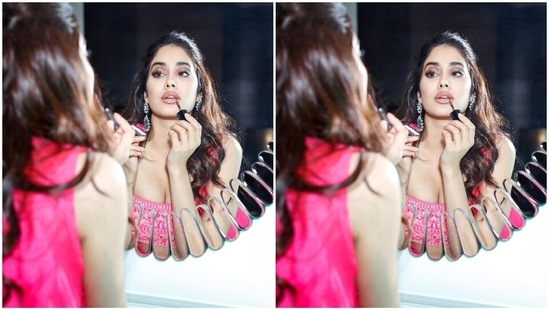 Janhvi's outfit features a cropped blouse with spaghetti straps, a plunging square neckline, a midriff-baring hem, and intricate dori embroidery done in a contrasting white shade. She wore it with matching bright pink sharara pants. They have a high-rise waistline, flared hem, and similar dori embroidery.(Instagram)