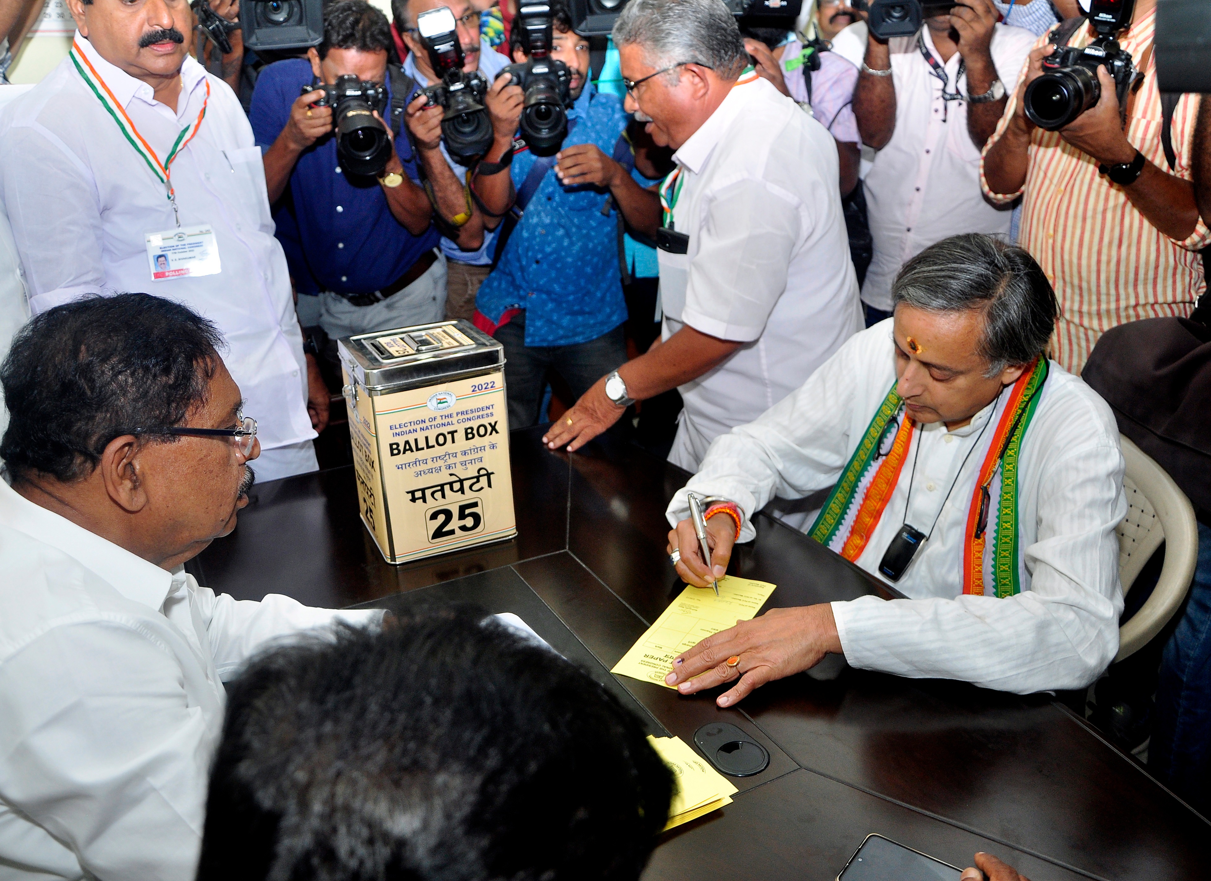 Congress presidential candidate Shashi Tharoor goes through the election procedure to cast his vote, at Indira Bhavan, in Thiruvananthapuram. (ANI Photo) Congress presidential candidate Shashi Tharoor goes through the election procedure to cast his vote, at Indira Bhavan, in Thiruvananthapuram. (ANI Photo)