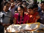 The distraught daughter and son during the funeral of Puran Krishan Bhat in Jammu on Sunday. Bhat was shot dead at his home in Shopian district on Saturday.&nbsp;