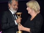 Britain's Queen Camilla presents winner Shehan Karunatilaka with trophee for "The Seven Moons of Maali Almeida" at the Booker Prize for Fiction 2022 awards ceremony, in London, Britain, REUTERS/Toby Melville/Pool