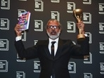 Author Shehan Karunatilaka holds the Booker Prize during a photo call after the announcement of his victory, at the Roundhouse, in London, October 17.