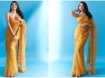 Sarees are a woman's best friend, and your favourite Bollywood fashionistas know it too. Jacqueline Fernandez is the latest star to prove the same to us with her pictures from a new photoshoot. She dressed in a gorgeous yellow saree and matching blouse to attend an event and later dropped images of herself in the traditional look on social media.(Instagram)