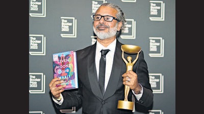 Author Shehan Karunatilaka holds the Booker Prize during a photo call after the announcement of his victory, at the Roundhouse, in London. (AP) Author Shehan Karunatilaka holds the Booker Prize during a photo call after the announcement of his victory, at the Roundhouse, in London. (AP)